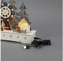 Dekorative LED-Leuchte mit Weihnachtsmotiv, darunter ein Riesenrad, ein Haus, Bäume und ein Hirsch