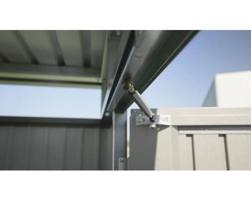 Vue détaillée d''une porte de cabanon de jardin avec ressort à gaz