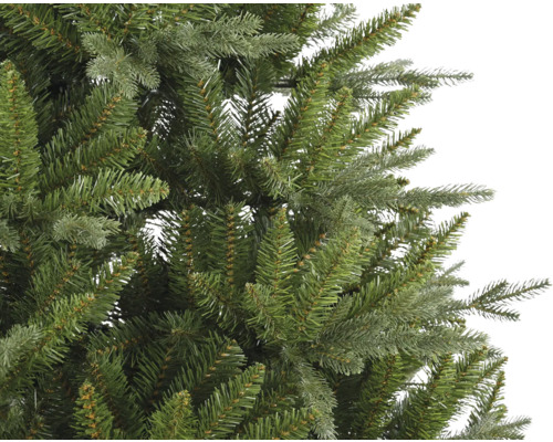 Gros plan d''un sapin de Noël artificiel avec des aiguilles vertes