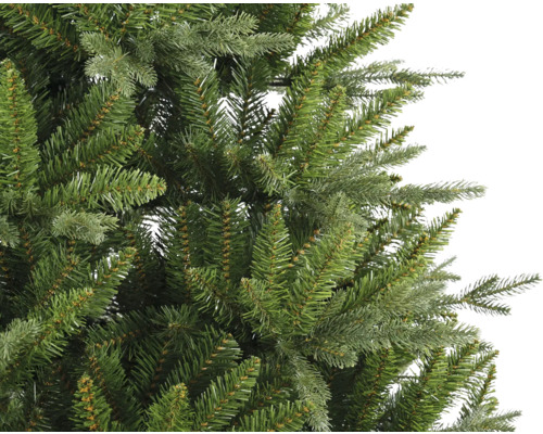 Gros plan d''un sapin de Noël artificiel avec des aiguilles vertes