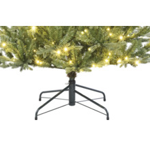 Gros plan d''un sapin de Noël artificiel avec éclairage et support