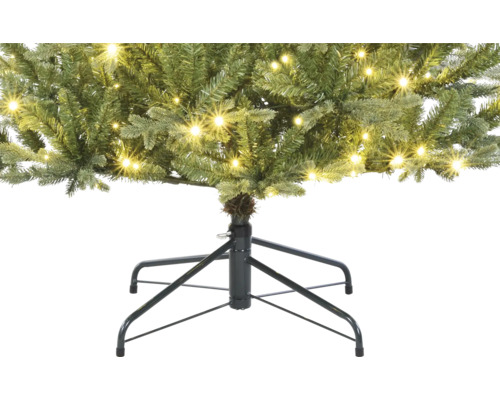 Gros plan d''un sapin de Noël artificiel avec éclairage et support