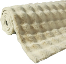 Gerollte, flauschige Kuscheldecke mit Strukturmuster