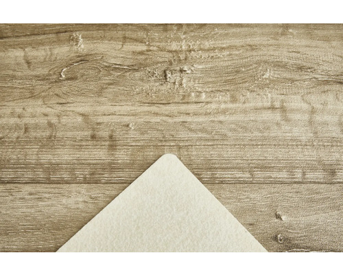 Holzstruktur mit einer Ecke eines Papierbogens