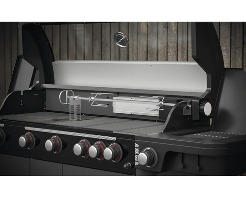 Gril à gaz avec fonction tournebroche et plusieurs boutons de commande.