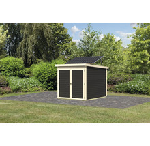 Abri de jardin avec système solaire dans le jardin