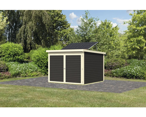 Abri de jardin avec système solaire dans le jardin