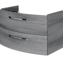 Geschwungener Waschtischunterschrank mit zwei Schubladen in Holzoptik und Metallgriffen.