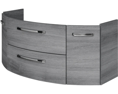 Gebogener Waschbeckenunterschrank in grauer Holzoptik mit drei Schubladen und silbernen Metallgriffen.