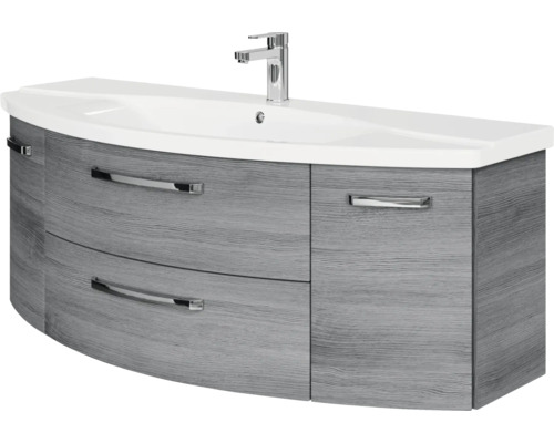 Waschtischunterschrank mit Waschbecken und Armatur, geschwungene Front, Holzdekor grau, verchromte Griffe.