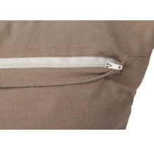 Gros plan d''un coussin avec fermeture éclair