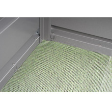 Vue détaillée d''une cabane de jardin avec une grille de fond