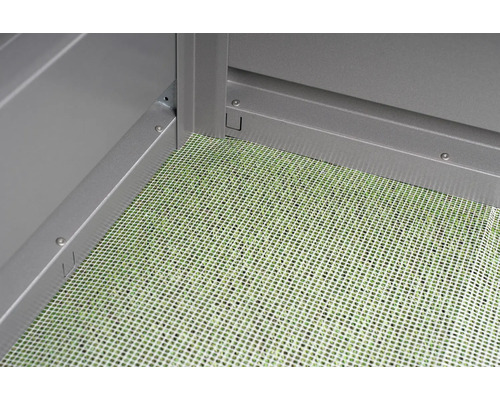 Vue détaillée du plancher d''un abri de jardin avec un tapis de sol.