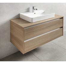 Meuble-lavabo avec deux tiroirs et lavabo à poser dans la salle de bains.