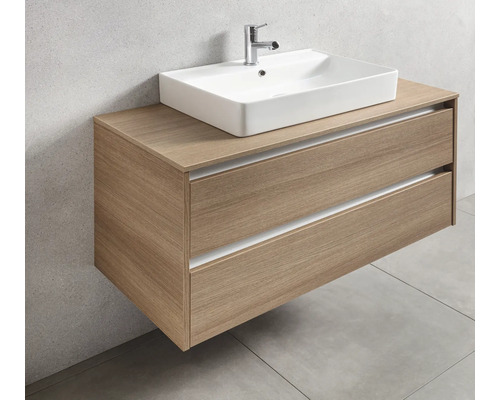 Meuble-lavabo avec deux tiroirs et lavabo à poser dans la salle de bains.