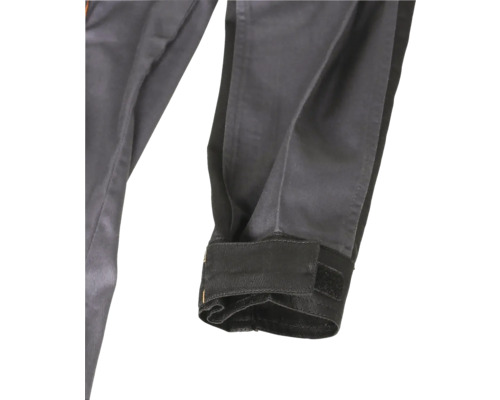 Détail d'une jambe de pantalon avec manchette et fermeture Velcro