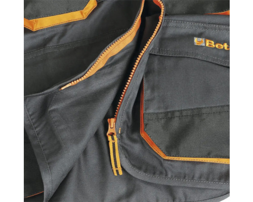 Détail d'un gilet de travail avec fermeture éclair et poches