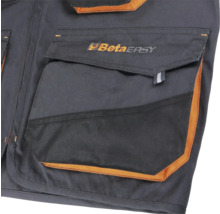 Détail d'un gilet de travail avec poches et logo Beta Easy
