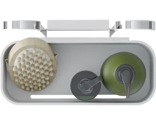 Aufsicht auf eine Duschablage mit Massagebürste und Seifenspender