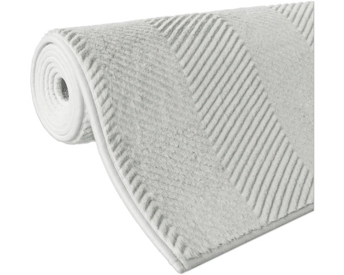 Tapis de bain enroulé avec motif rayé