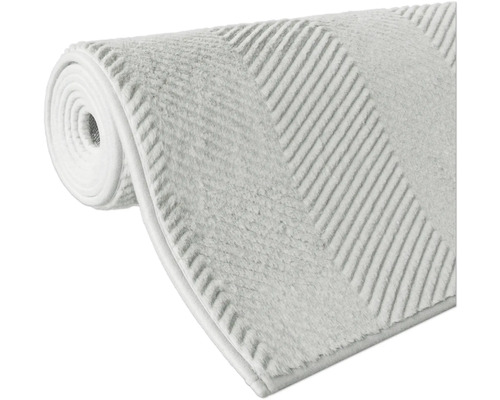 Tapis de bain enroulé avec motif rayé