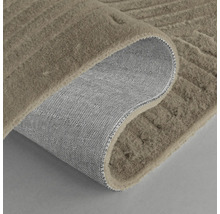 Tapis avec structure en relief et envers tissé