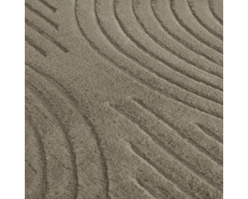 Vue détaillée d'un tapis avec motif en relief