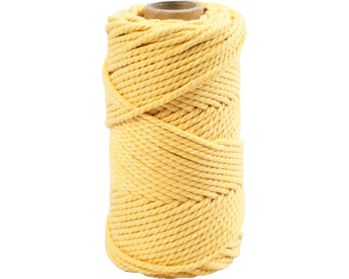 Gelbe Baumwollschnur auf einer Spule