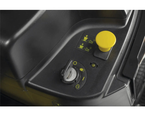 Vue détaillée des commandes d'un tracteur de pelouse avec contacteur d'allumage et commande d'éjection