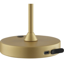 Detailaufnahme des Sockels einer Tischleuchte mit USB-Anschluss.