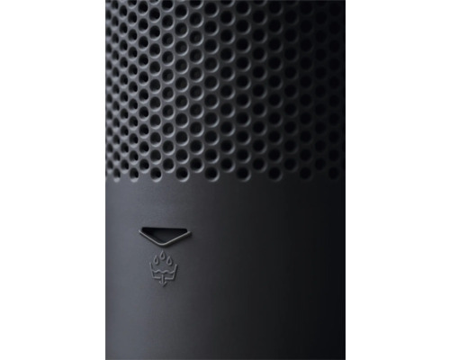 Gros plan d'un appareil avec structure à trous ronds et symbole d'évacuation de l'eau