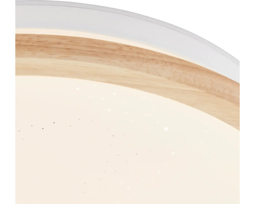 Gros plan d'un plafonnier avec décor en bois