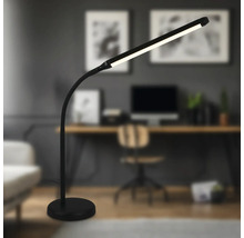 Schreibtisch mit einer schwarzen LED-Stehlampe im modernen Stil