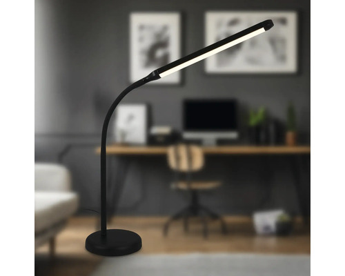 Schreibtisch mit einer schwarzen LED-Stehlampe im modernen Stil