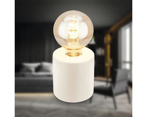 Dekorative Tischleuchte mit runder Glühbirne auf einem zylinderförmigen Sockel