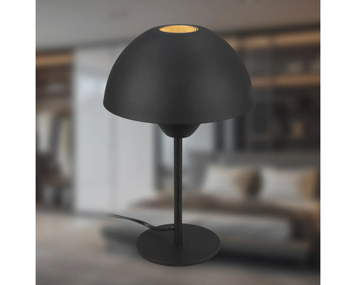 Schwarze Tischleuchte mit halbkugelförmigem Schirm auf einem schlanken Ständer