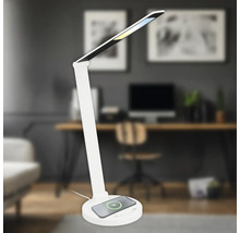 Weisse Schreibtischleuchte mit kabelloser Ladefunktion in Büroumgebung