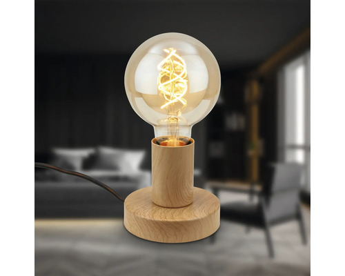 Dekorative Tischleuchte mit Glühbirne und Holzfuß