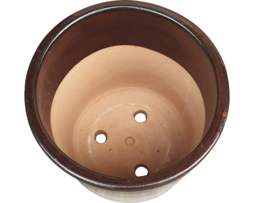 Vue intérieure d'un pot de fleurs avec trous de drainage