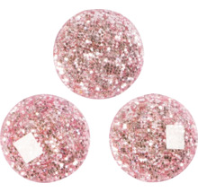 Drei runde, glitzernde Dekorationsartikel für den Innenbereich