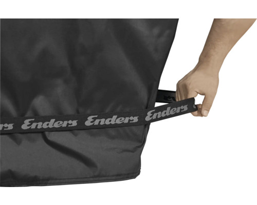 Gros plan d'une housse de protection pour barbecue Enders avec sangle de maintien