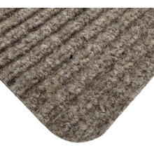 Gros plan d'un paillasson avec une structure côtelée