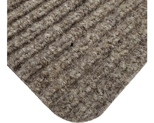 Gros plan d'un paillasson avec une structure côtelée