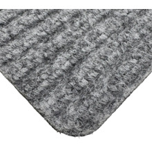 Gros plan d'un tapis gris à structure bouclée