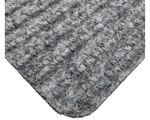 Gros plan d'un tapis gris à structure bouclée