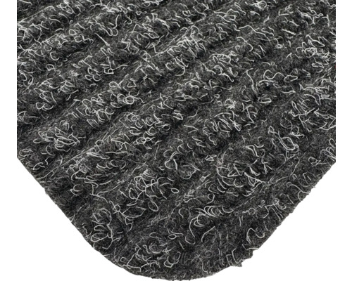 Vue détaillée d'un paillasson gris avec surface textile