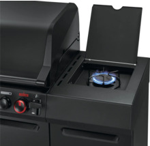 Barbecue à gaz noir avec brûleur latéral en marche