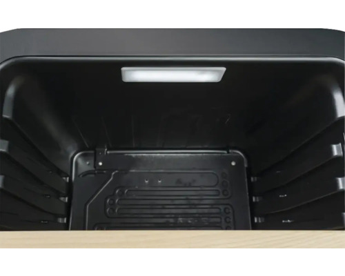 Vue intérieure d'une glacière noire avec éclairage intérieur