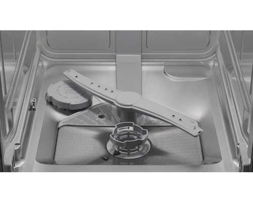 Vue intérieure d'un lave-vaisselle avec bras d'aspersion, réservoir à sel et filtre