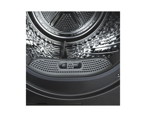 Vue intérieure d'une machine à laver avec tambour et filtre à peluches